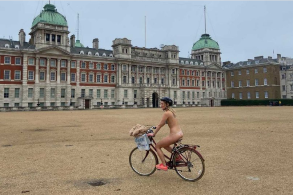Woman cycles around London without clothes for charity after flatmate's dare